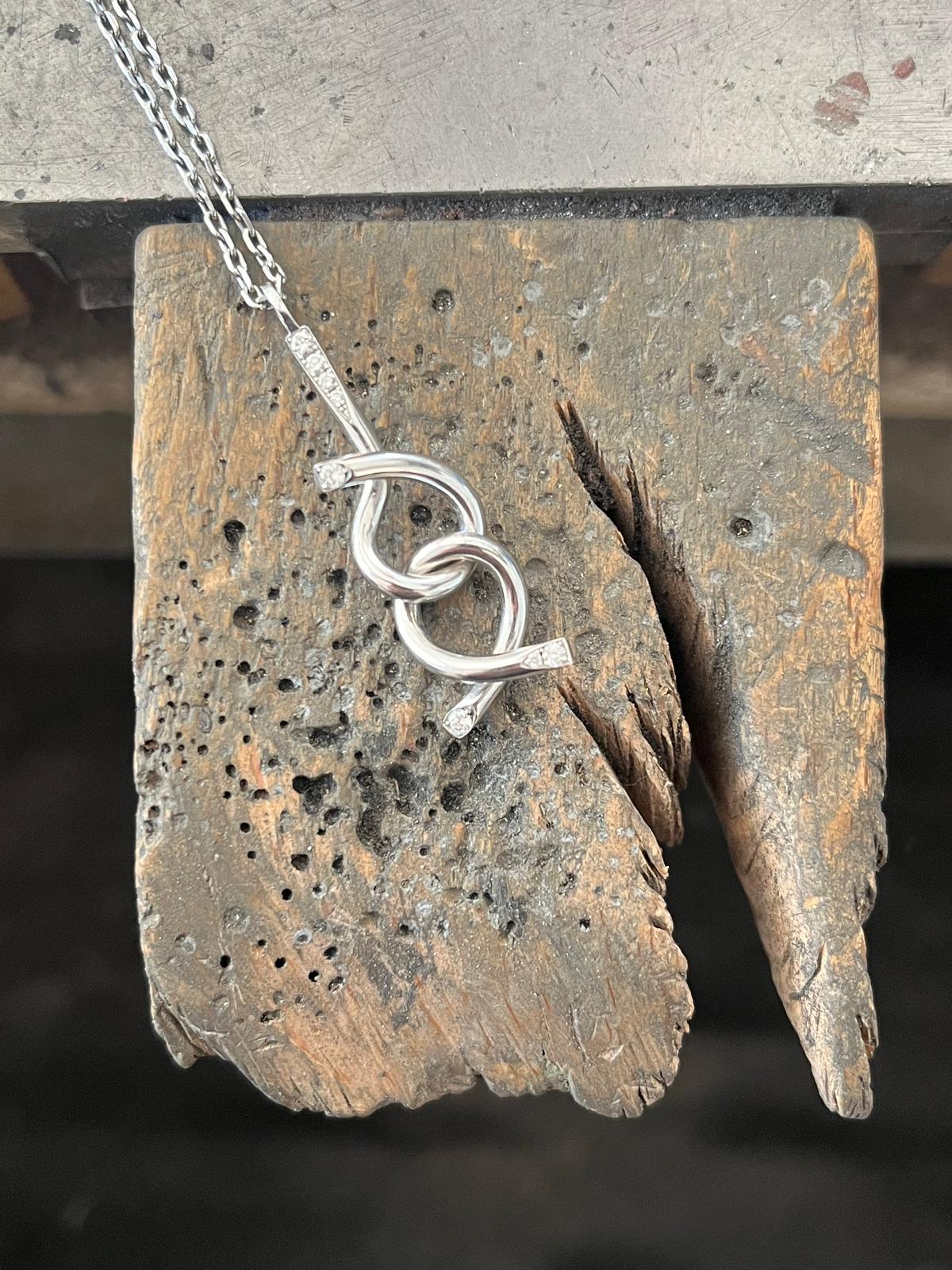 Adair brain teaser necklace being crafted