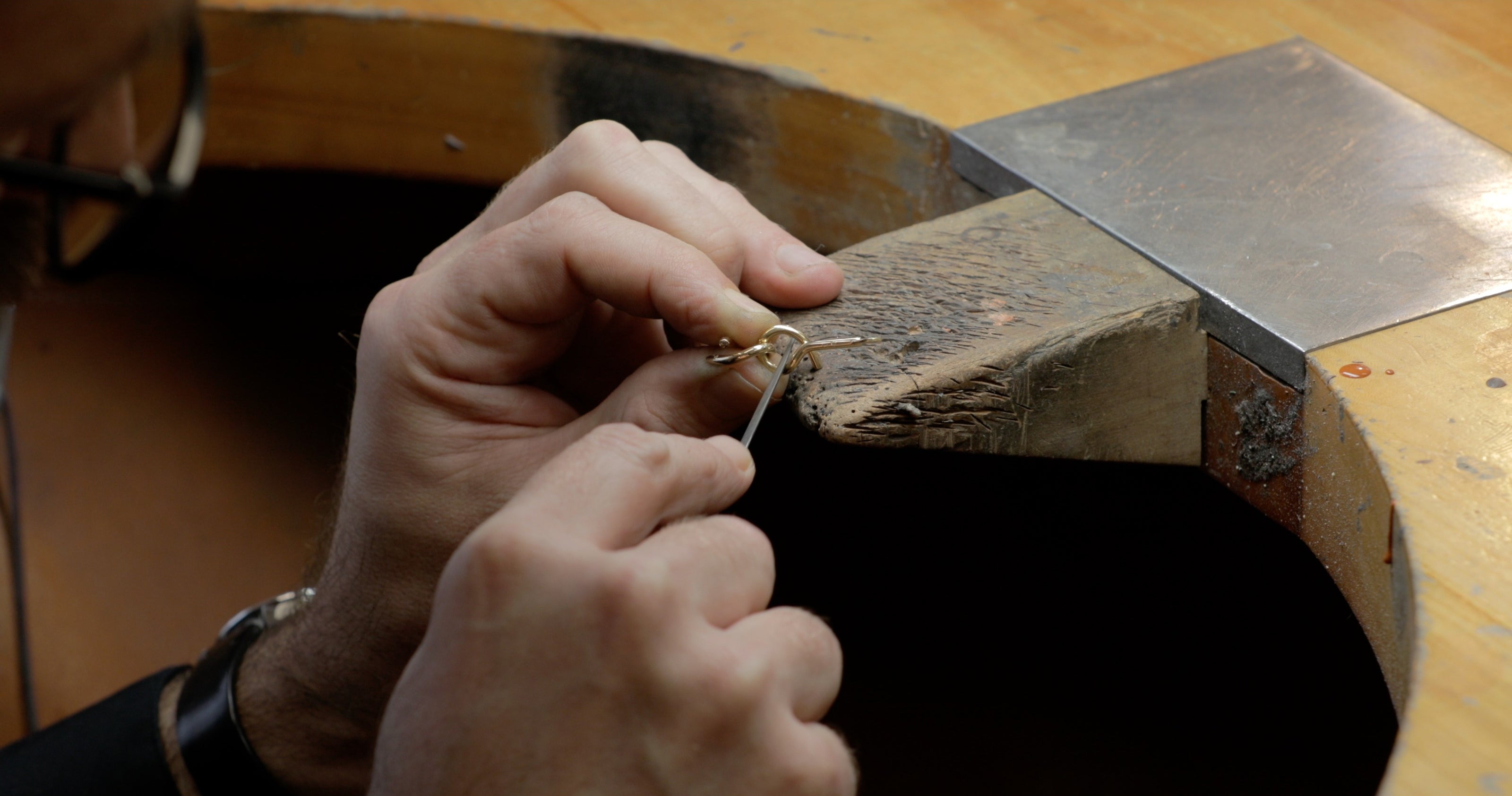 Swiss artisan crafting the Adair Jewelry brain teaser necklace